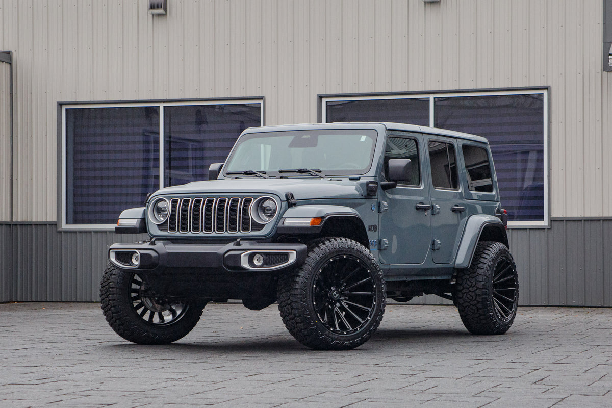 2025 Jeep Wrangler Sahara 4XE with a 2.5" Rough Country lift kit, 22x12 Hostile H123 wheels, and 35" Fury Country Hunter R/T tires.