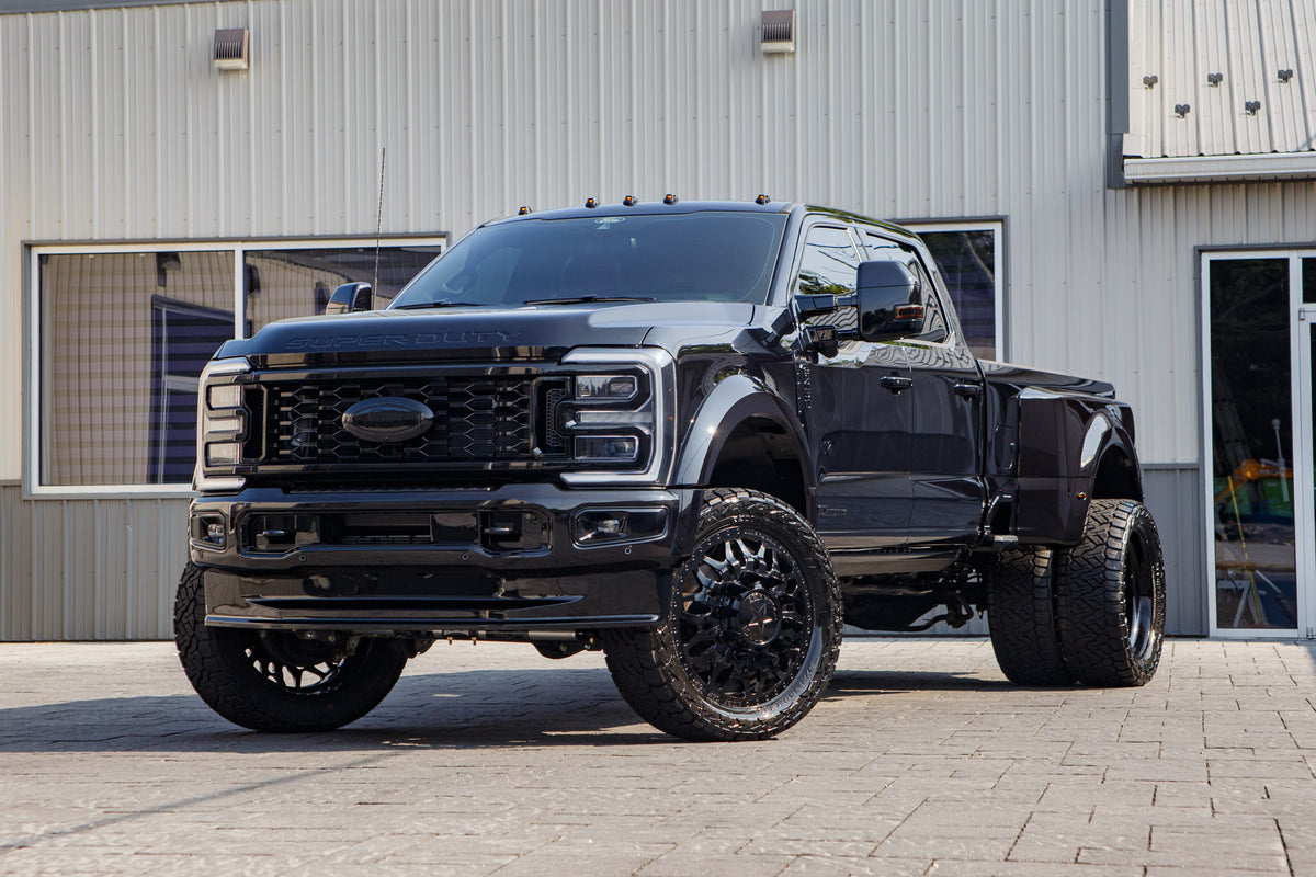 2026 Ford F-450 Super Duty Platinum with a 4" Wicked lift kit, 24x8.25 American Force Shrapnel wheels, and 37" Nitto Recon Grappler A/T tires.
