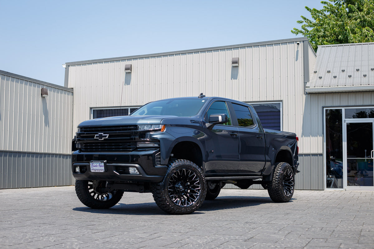 2022 Chevrolet Silverado 1500 LT Trail Boss with a 6" Rough Country lift kit, 22x12 Fuel Strike wheels, and 35" Avix Trailtek R/T tires.