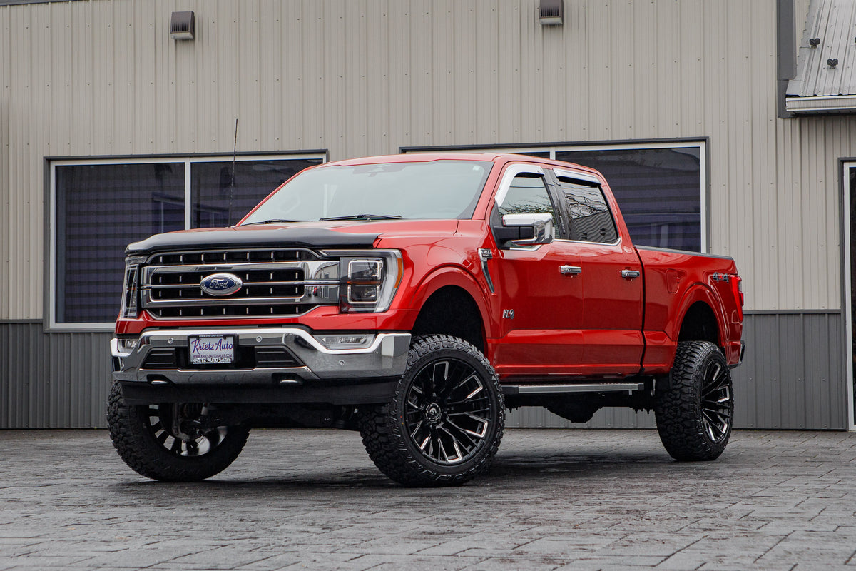 2023 Ford F-150 Lariat with a 6" Rough Country lift kit, 22x12 Fuel Rebar wheels, and 35" Fury Country Hunter R/T tires.