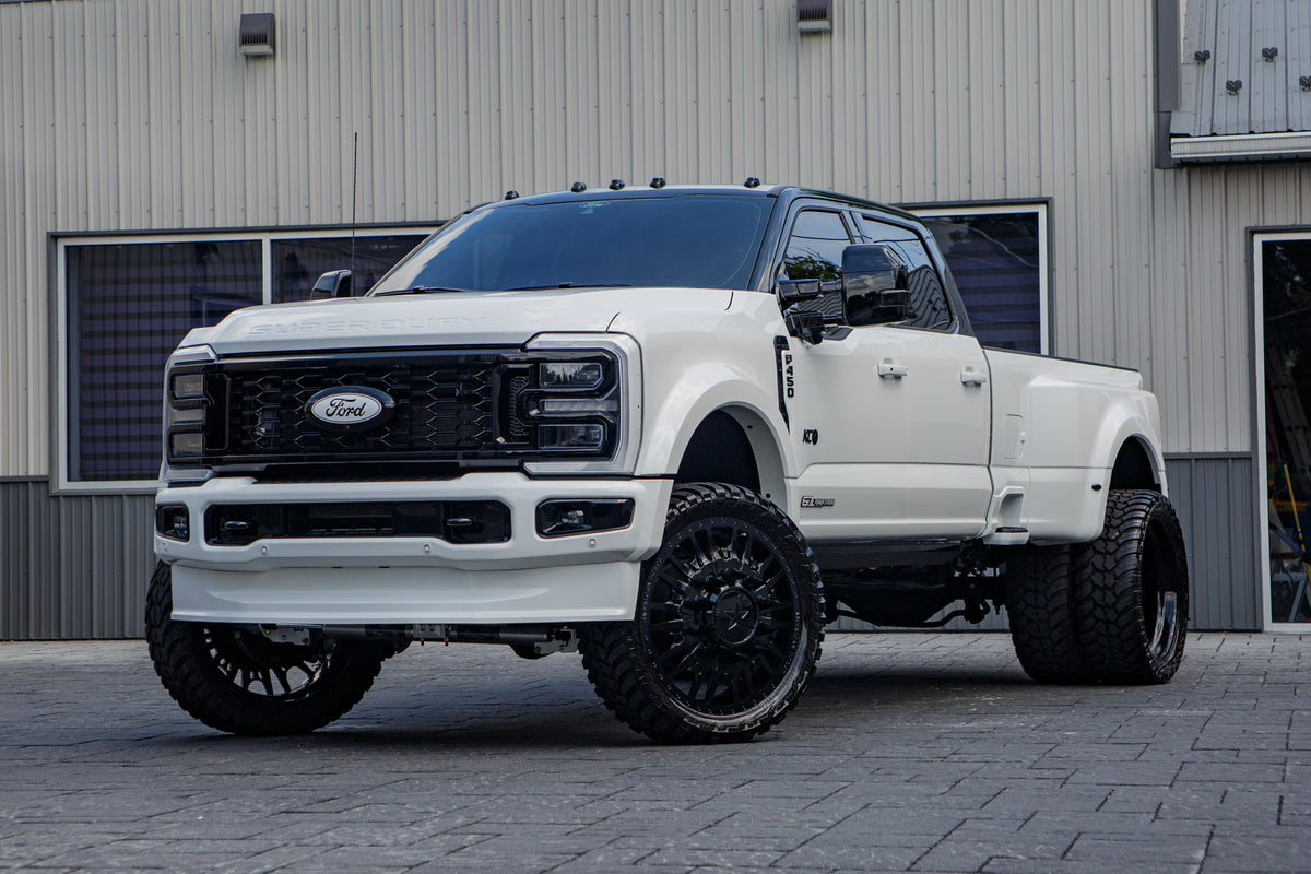 2026 Ford F-450 Super Duty Platinum with a 4" Wicked lift kit, 26x8.25 American Force Notch wheels, and 37" AMP Terrain Attack M/T A tires.