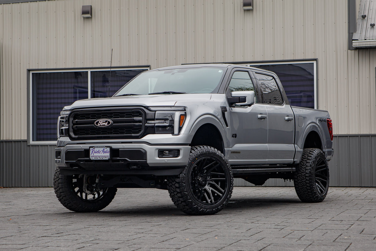 2025 Ford F-150 Lariat with a 6" Rough Country lift kit, 22x12 TIS 554B wheels, and 35" Fury Country Hunter R/T tires.