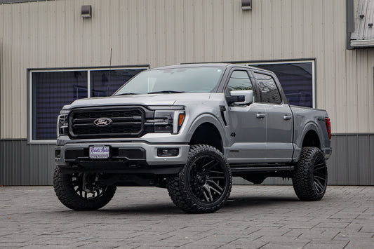 2025 Ford F-150 Lariat with a 6" Rough Country lift kit, 22x12 TIS 554B wheels, and 35" Fury Country Hunter R/T tires.