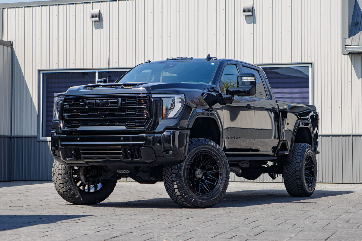 2026 GMC Sierra 2500 AT4 with a 5" BDS lift kit, 22x12 Arena Battle wheels, and 37" Nitto Ridge Grappler tires.