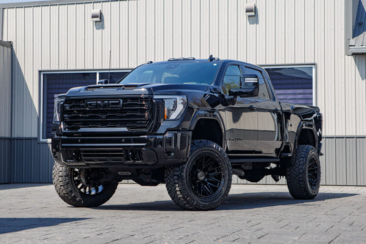 2026 GMC Sierra 2500 AT4 with a 5" BDS lift kit, 22x12 Arena Battle wheels, and 37" Nitto Ridge Grappler tires.