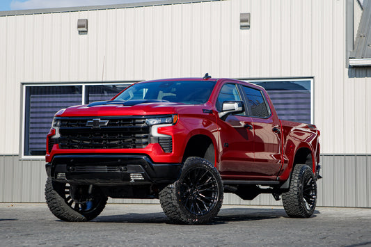 2025 Chevrolet Silverado 1500 LT Trail Boss with a 6" Rough Country lift kit, 22x12 Fuel Rebar wheels, and 35" Fury Country Hunter R/T tires.