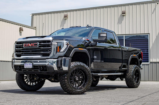 2025 GMC Sierra 2500 SLE with a 5" BDS lift kit, 22x12 TIS 547B wheels, and 37" Nitto Ridge Grappler tires.