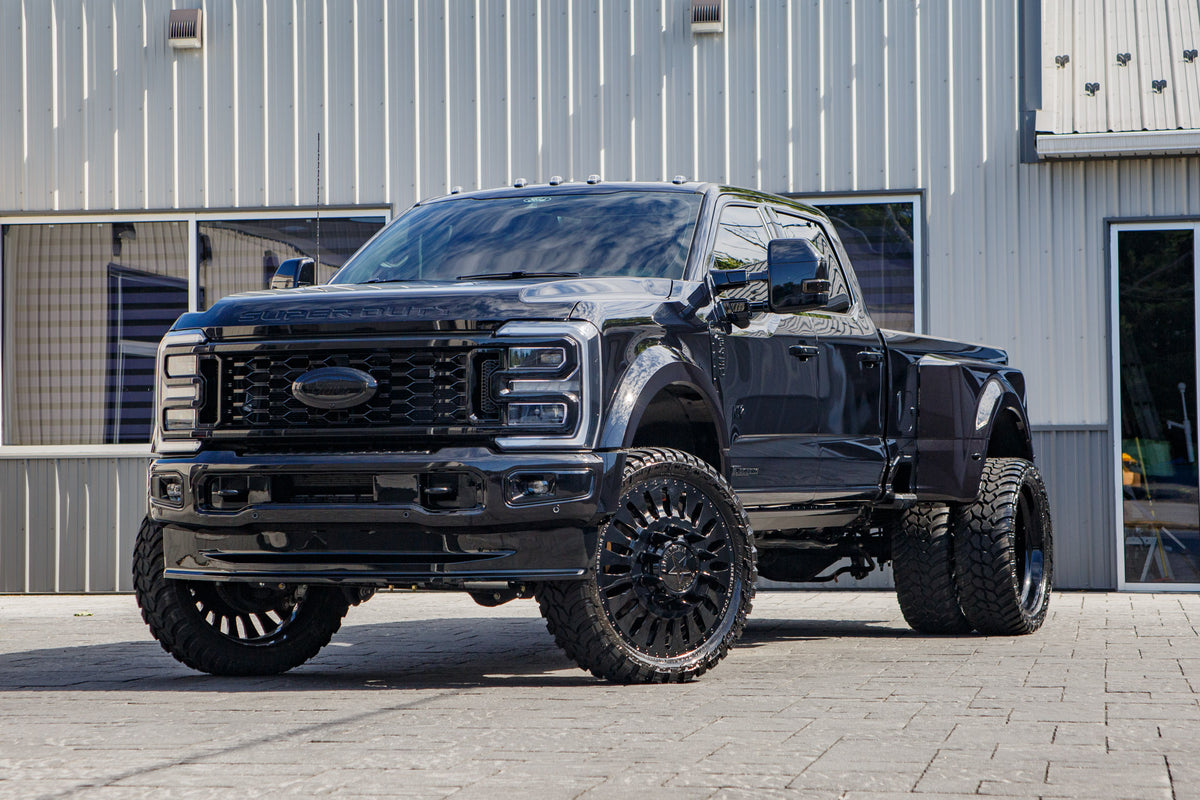 2026 Ford F-450 Super Duty Platinum with a 4" Wicked lift kit, 26x8.25 American Force Massive wheels, and 37" AMP Terrain Attack M/T A tires.
