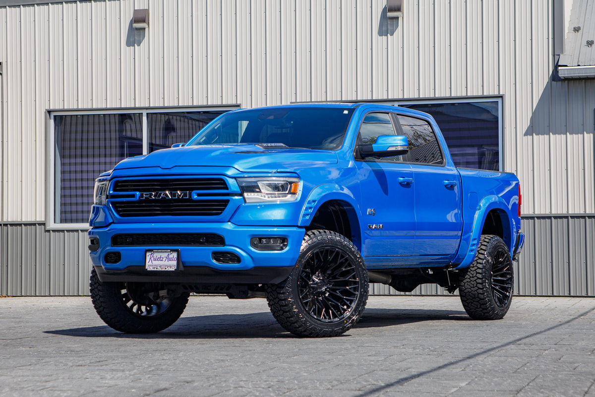2022 Ram 1500 Laramie with a 6" Rough Country lift kit, 22x12 Fuel Strike wheels, and 35" Fury Country Hunter R/T tires.