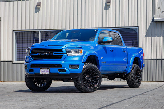 2022 Ram 1500 Laramie with a 6" Rough Country lift kit, 22x12 Fuel Strike wheels, and 35" Fury Country Hunter R/T tires.