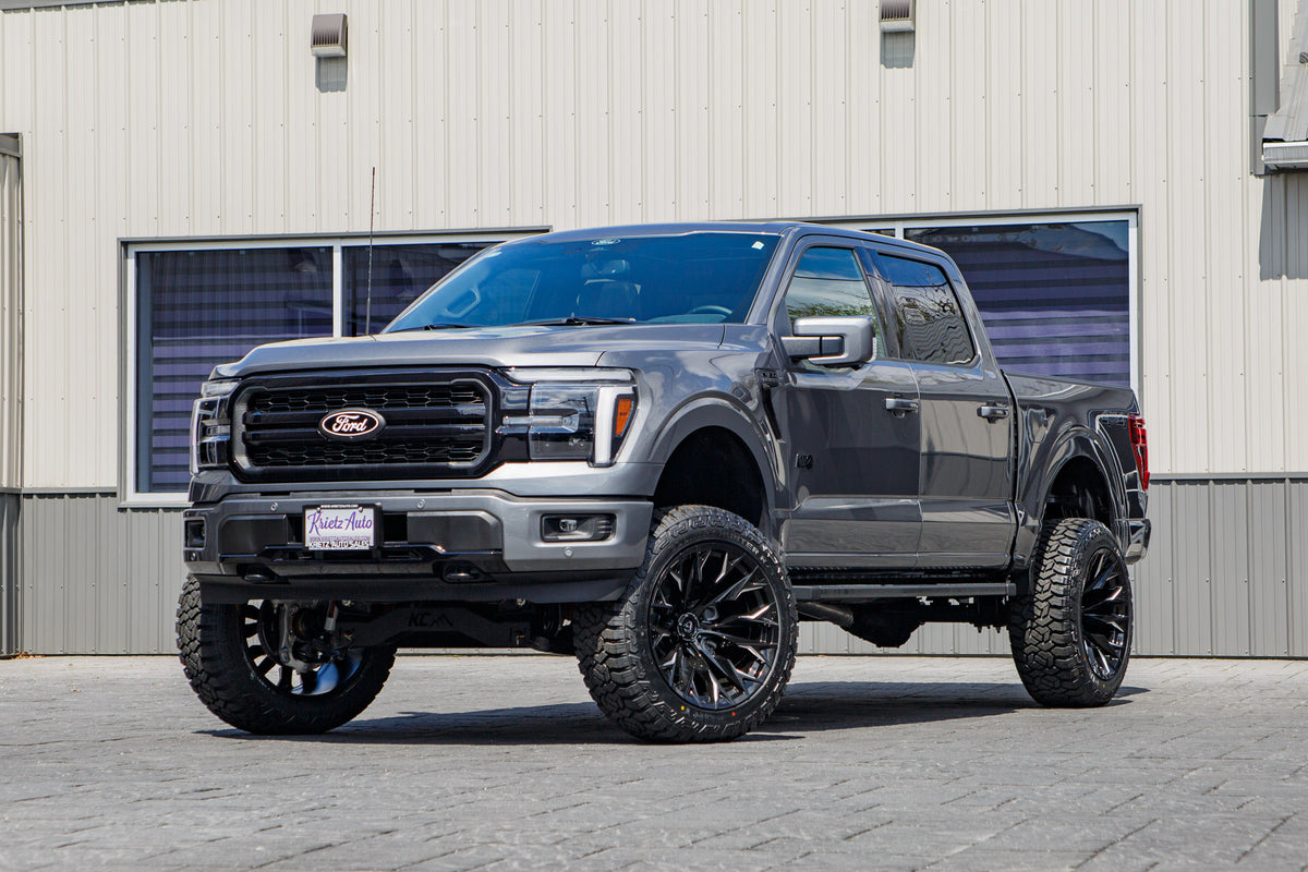 2025 Ford F-150 Lariat with a 6" Rough Country lift kit, 22x12 Fuel Flame wheels, and 35" Fury Country Hunter R/T tires.