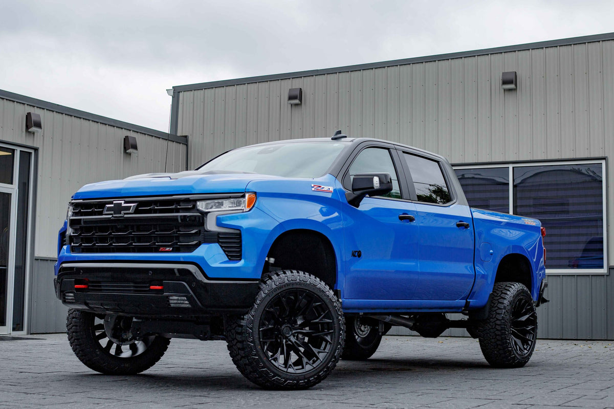 2025 Chevrolet Silverado 1500 LT Trail Boss with a 6" Rough Country lift kit, 22x12 Fuel Flame wheels, and 35" Fury Country Hunter R/T tires.