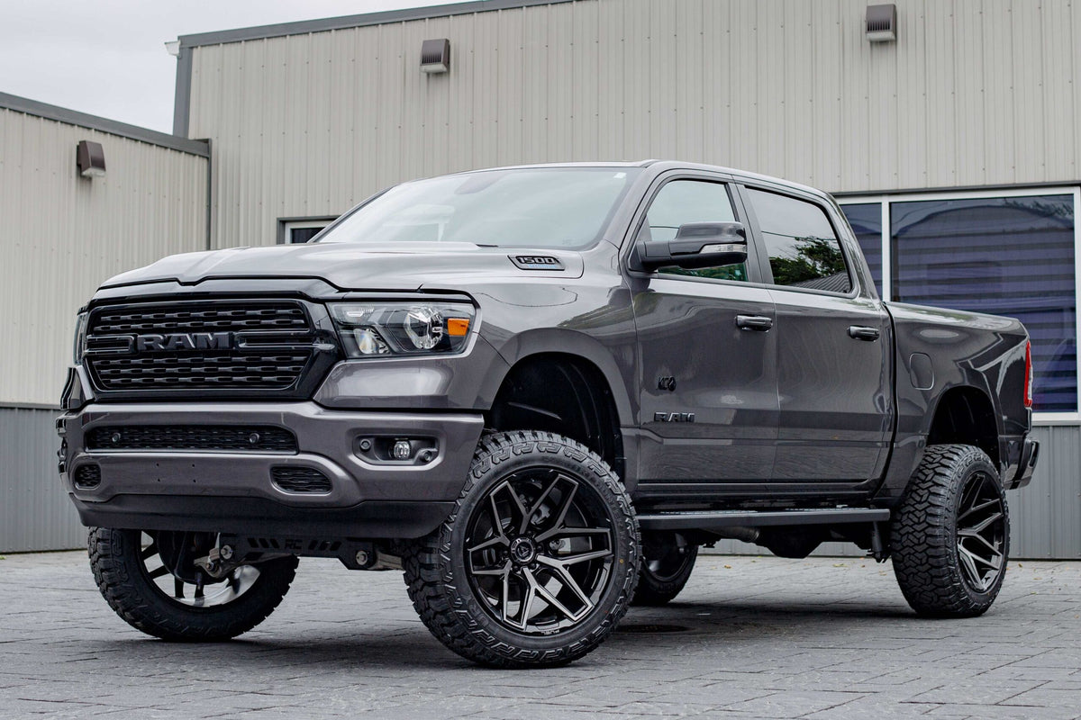 2022 Ram 1500 Lone Star with a 6" Rough Country lift kit, 22x12 Fuel Flux wheels, and 35" Fury Country Hunter R/T tires.