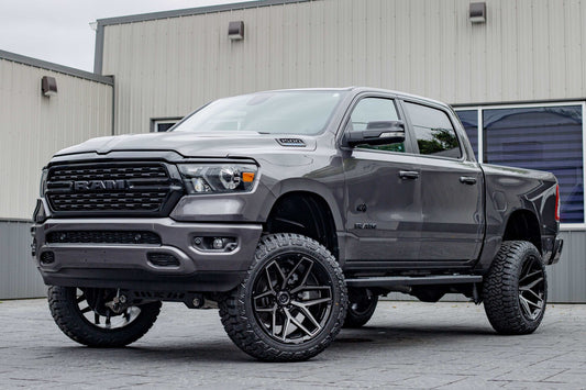 2022 Ram 1500 Lone Star with a 6" Rough Country lift kit, 22x12 Fuel Flux wheels, and 35" Fury Country Hunter R/T tires.