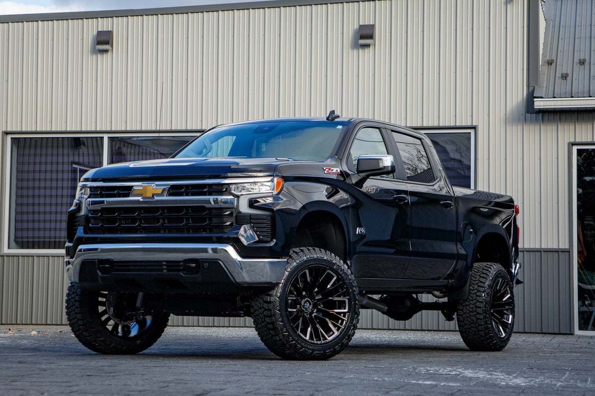 2025 Chevrolet Silverado 1500 LT with a 6" Rough Country lift kit, 22x12 Fuel Rebar wheels, and 35" Fury Country Hunter R/T tires.