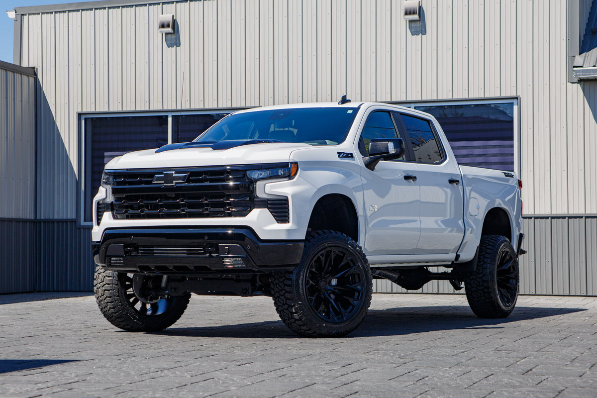 2026 Chevrolet Silverado 1500 LT Trail Boss with a 6" Rough Country lift kit, 22x12 Fuel Flame wheels, and 35" Fury Country Hunter R/T tires.