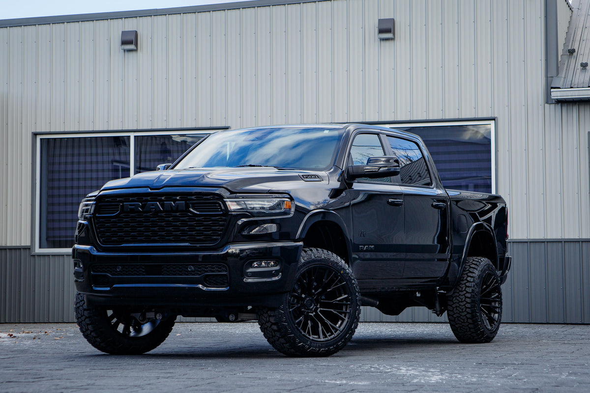 2025 Ram 1500 Big Horn with a 6" Rough Country lift kit, 22x12 Fuel Rebar wheels, and 35" Fury Country Hunter R/T tires.