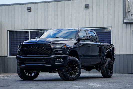 2025 Ram 1500 Big Horn with a 6" Rough Country lift kit, 22x12 Fuel Rebar wheels, and 35" Fury Country Hunter R/T tires.