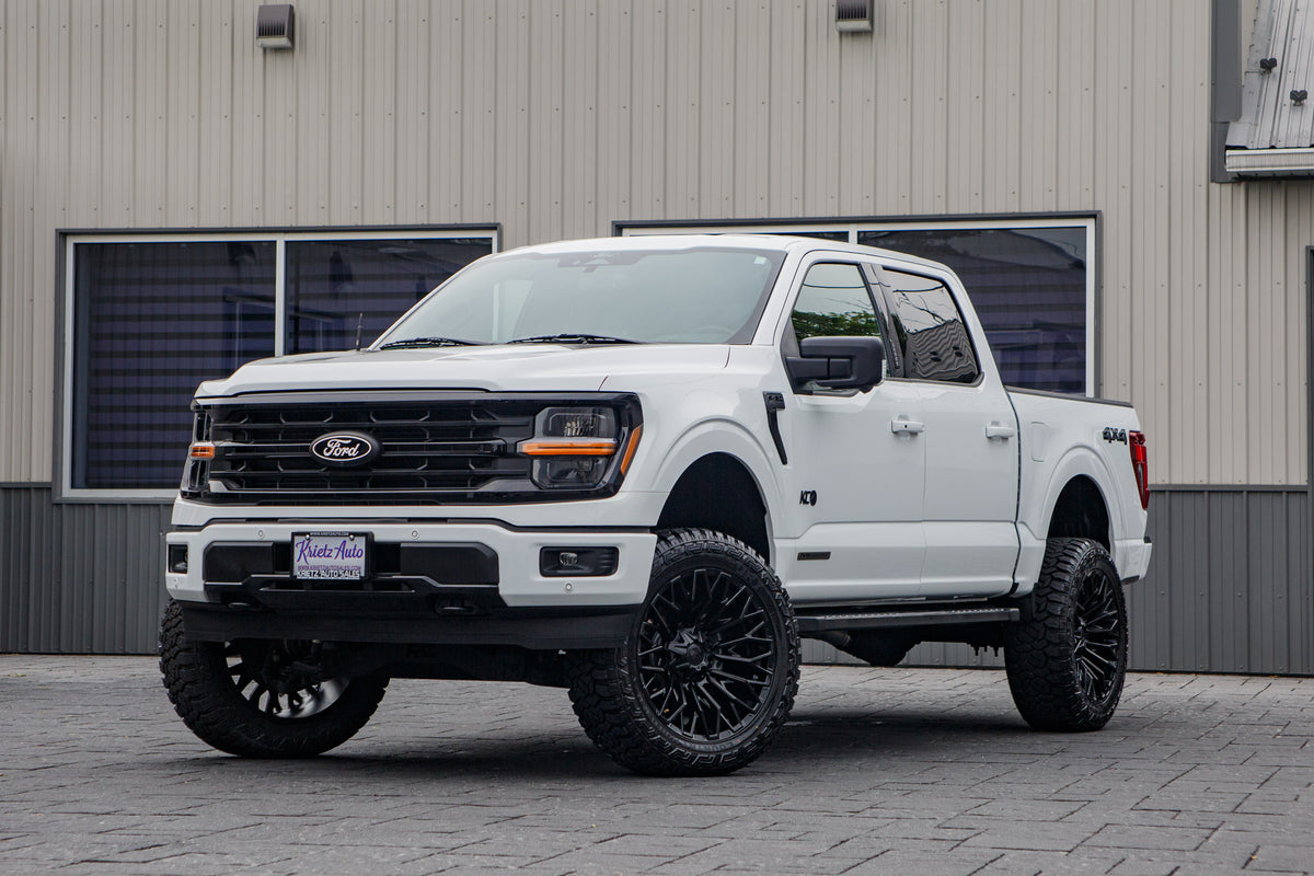 2024 Ford F-150 XLT with 22x10 Fuel Strike wheels and 35" Fury Country Hunter R/T tires.