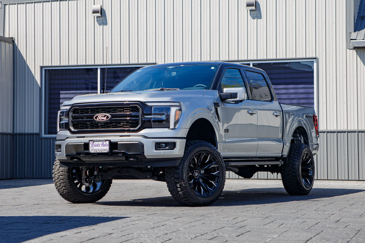 2025 Ford F-150 Lariat with a 6" Rough Country lift kit, 22x12 Fuel Flame wheels, and 35" Fury Country Hunter R/T tires.