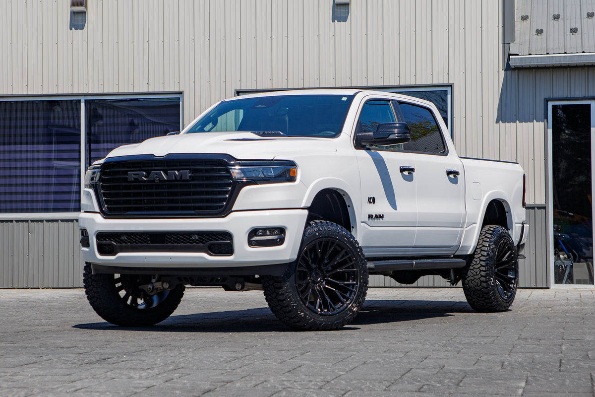 2025 Ram 1500 Laramie with a 6" Rough Country lift kit, 22x12 Fuel Rebar wheels, and 35" Fury Country Hunter R/T tires.