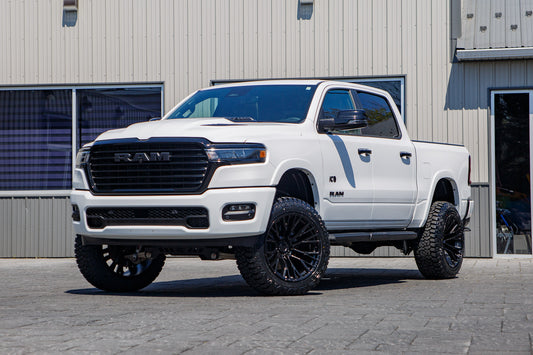 2025 Ram 1500 Laramie with a 6" Rough Country lift kit, 22x12 Fuel Rebar wheels, and 35" Fury Country Hunter R/T tires.