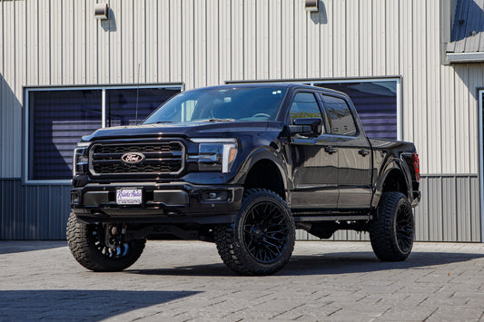 2025 Ford F-150 Lariat with a 6" Rough Country lift kit, 22x12 Fuel Strike wheels, and 35" Fury Country Hunter R/T tires.