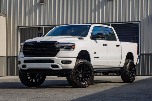 2023 Ram 1500 Big Horn with a 6" Rough Country lift kit, 22x12 Fuel Rebar wheels, and 35" Fury Country Hunter R/T tires.