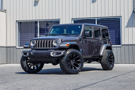 Jeep Wrangler Sahara 4XE with a 2.5" Rough Country lift kit, 22x12 Fuel Flame wheels, and 35" Fury Country Hunter R/T tires.