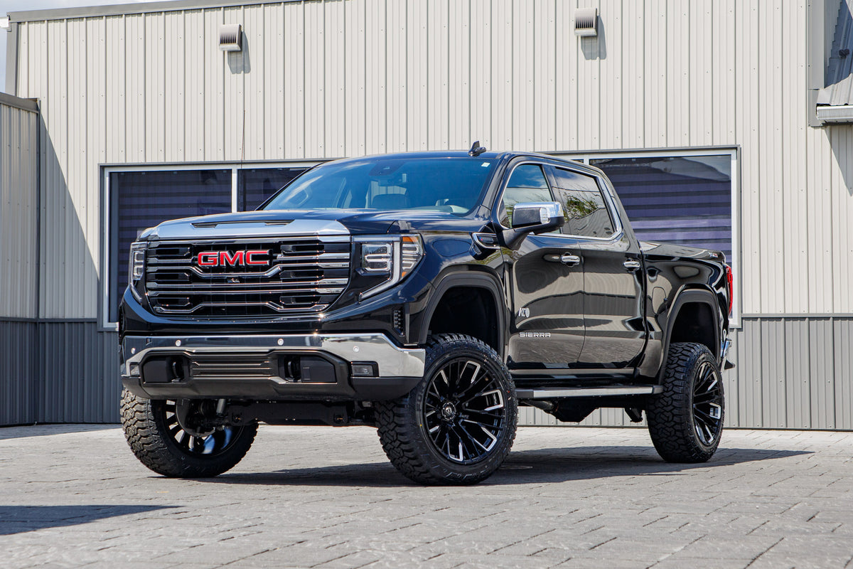 2026 GMC Sierra 1500 SLT with a 6" Rough Country lift kit, 22x12 Fuel Rebar wheels, and 35" Fury Country Hunter R/T tires.