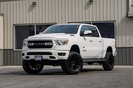 2023 Ram 1500 Big Horn with a 6" Rough Country lift kit, 22x12 Fuel Flame wheels, and 35" Fury Country Hunter R/T tires.