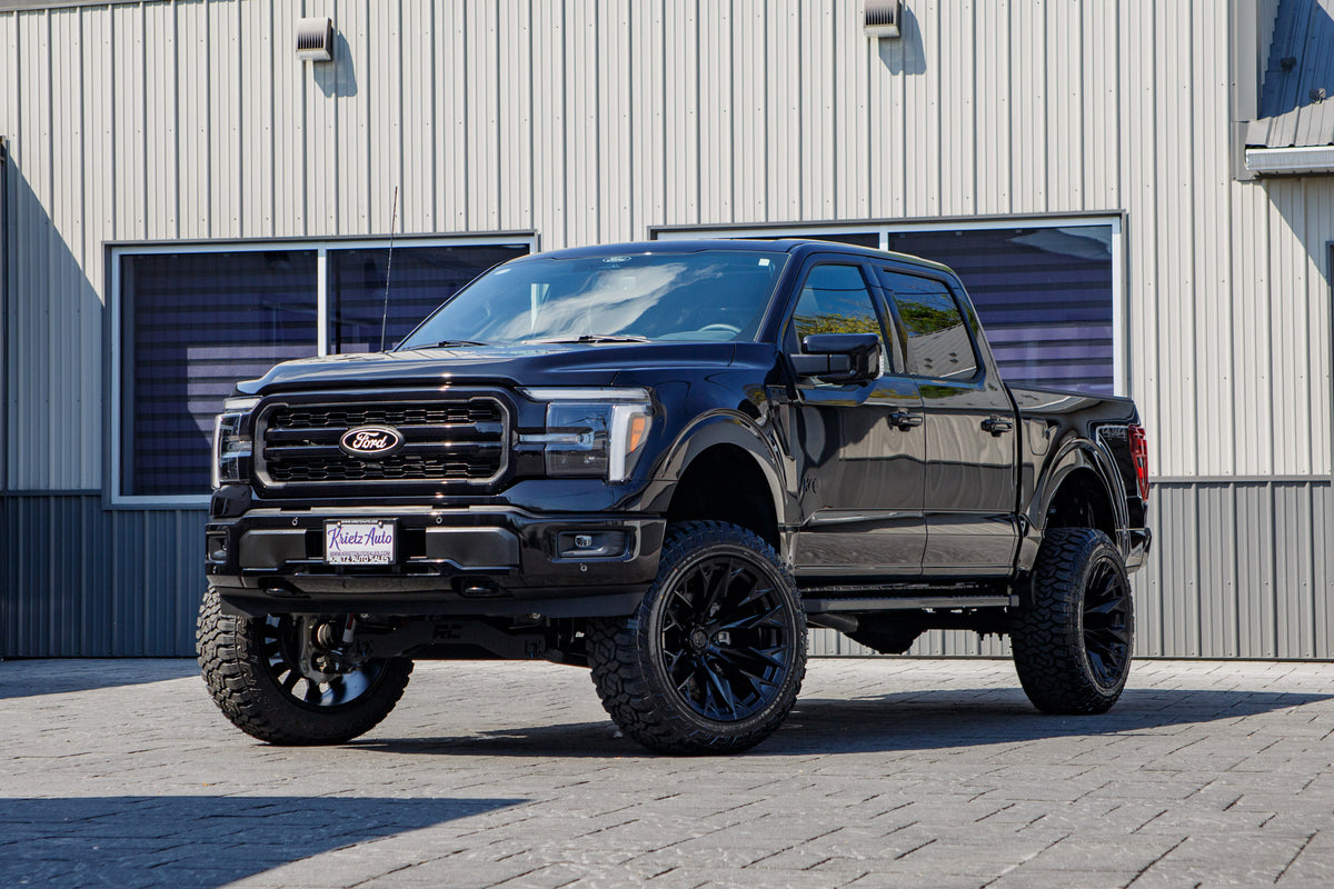 2025 Ford F-150 Lariat with a 6" Rough Country lift kit, 22x12 Fuel Flame wheels, and 35" Fury Country Hunter R/T tires.