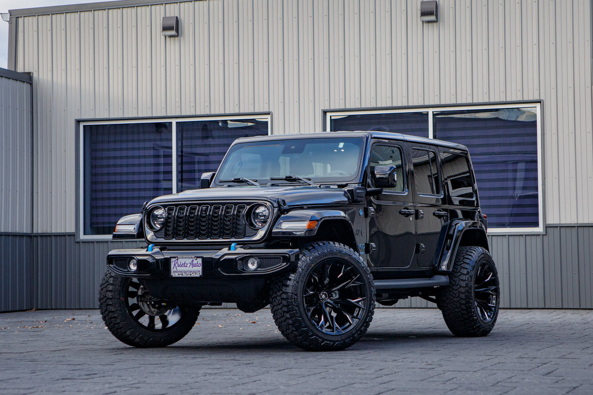 2024 Jeep Wrangler High Altitude 4XE with a 2.5" Rough Country lift kit, 22x12 Fuel Flame wheels, and 35" Fury Country Hunter R/T tires.