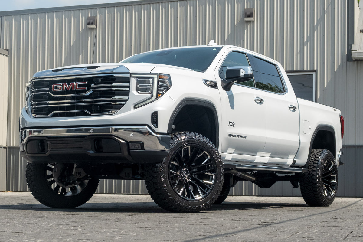 2026 GMC Sierra 1500 SLT with a 6" Rough Country lift kit, 22x12 Fuel Rebar wheels, and 35" Fury Country Hunter R/T tires.
