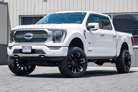 2023 Ford F-150 limited white with 6 inch readylift lift kit and 22x12 fuel rebar wheels and 35 inch nitto ridge grappler tires