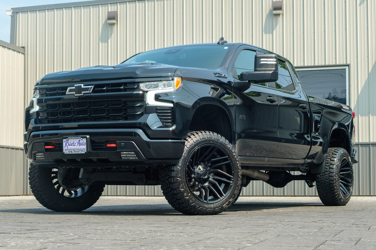 2025 Chevrolet Silverado 1500 LT Trail Boss with a 6" Rough Country lift kit, 22x12 Fuel Typhoon wheels, and 35" Fury Country Hunter R/T tires.