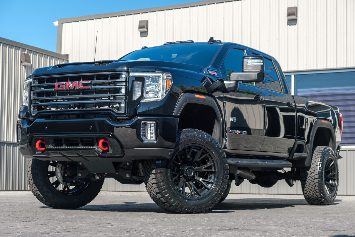 2023 GMC Sierra 3500 AT$ with a 5" BDS lift kit, 22x12 Fuel Catalyst wheels, and 37" Nitto Ridge Grappler tires.