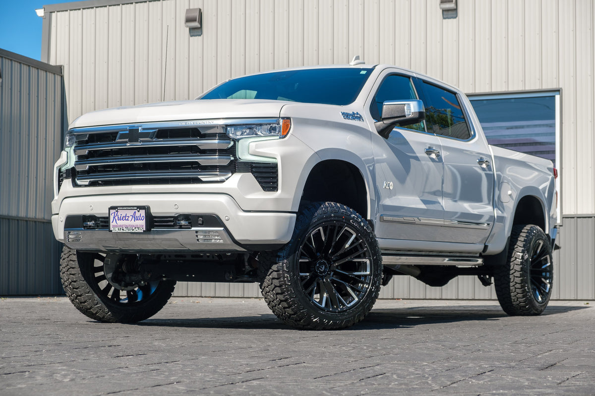 2024 Chevrolet Silverado 1500 High Country with a 6" Rough Country suspension kit, 22x12 Fuel Rebar wheels, and 35" Fury Country Hunter R/T tires.