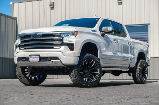 2024 Chevrolet Silverado 1500 High Country with a 6" Rough Country suspension kit, 22x12 Fuel Rebar wheels, and 35" Fury Country Hunter R/T tires.
