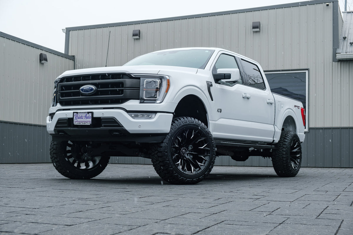 2023 Ford F-150 Lariat with a 6" Rough Country lift kit, 22x12 Fuel Flame wheels, and 35" Fury Country Hunter R/T tires.