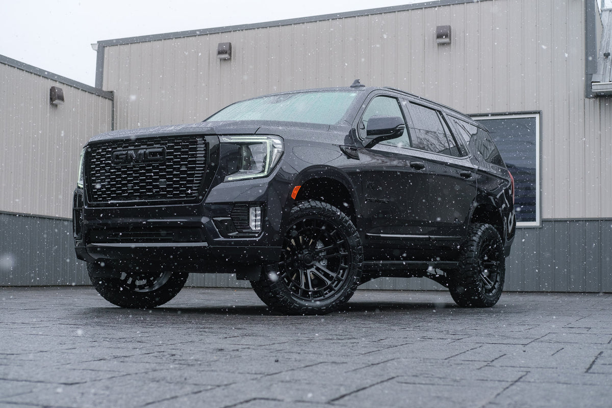 2024 GMC Yukon Denali with a 3" ReadyLift lift kit, 22x10 Fuel Heater wheels, and 295/50 Nitto Ridge Grappler tires.