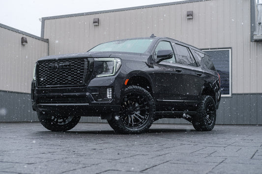 2024 GMC Yukon Denali with a 3" ReadyLift lift kit, 22x10 Fuel Heater wheels, and 295/50 Nitto Ridge Grappler tires.