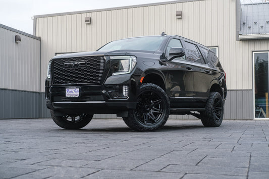 2023 GMC Yukon Denali with a 3" ReadyLift lift kit, 22x10 Fuel Brawl wheels, and 295/50 Toyo Open Country A/T III.