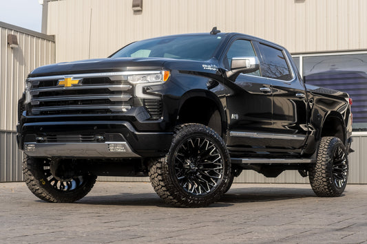 2024 Chevrolet Silverado 1500 High Country with a 6" Rough Country suspension kit, 22x12 Fuel Strike wheels, and 35" Fury Country Hunter R/T tires.
