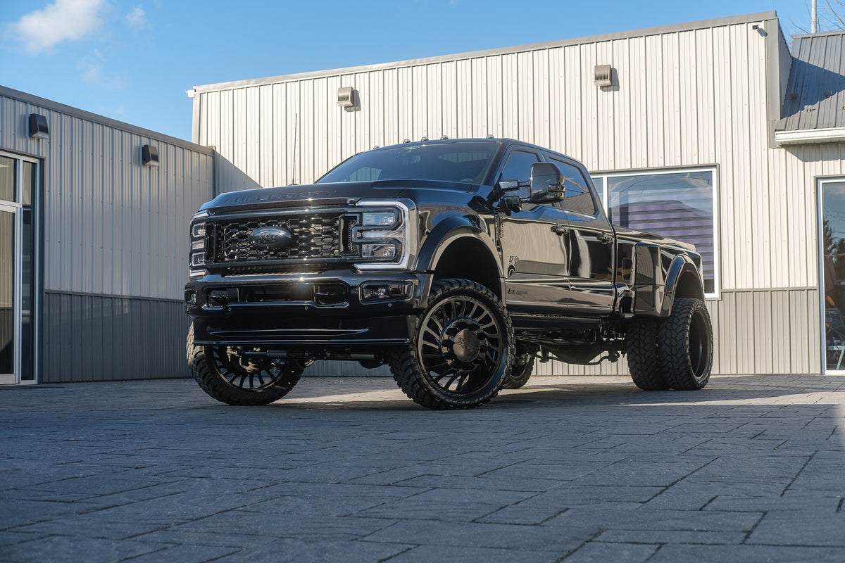 2024 Ford F-450 Super Duty Platinum with a 4" Wicked lift kit, 26x8.25 JTX Slayer wheels, and 37" AMP Terrain Attack tires.