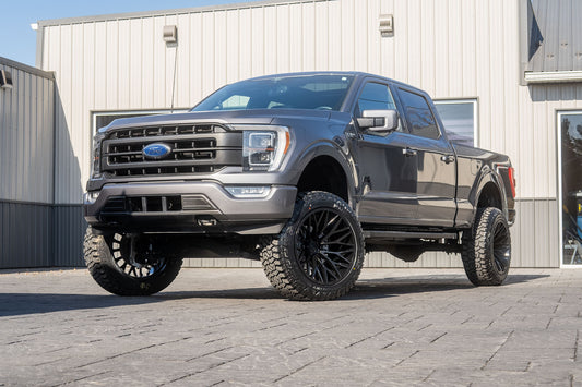 2021 Ford F-150 Lariat with a 6" Rough Country lift kit, 22x12 TIS 566BM wheels, and 35" Fury Country Hunter R/T tires.