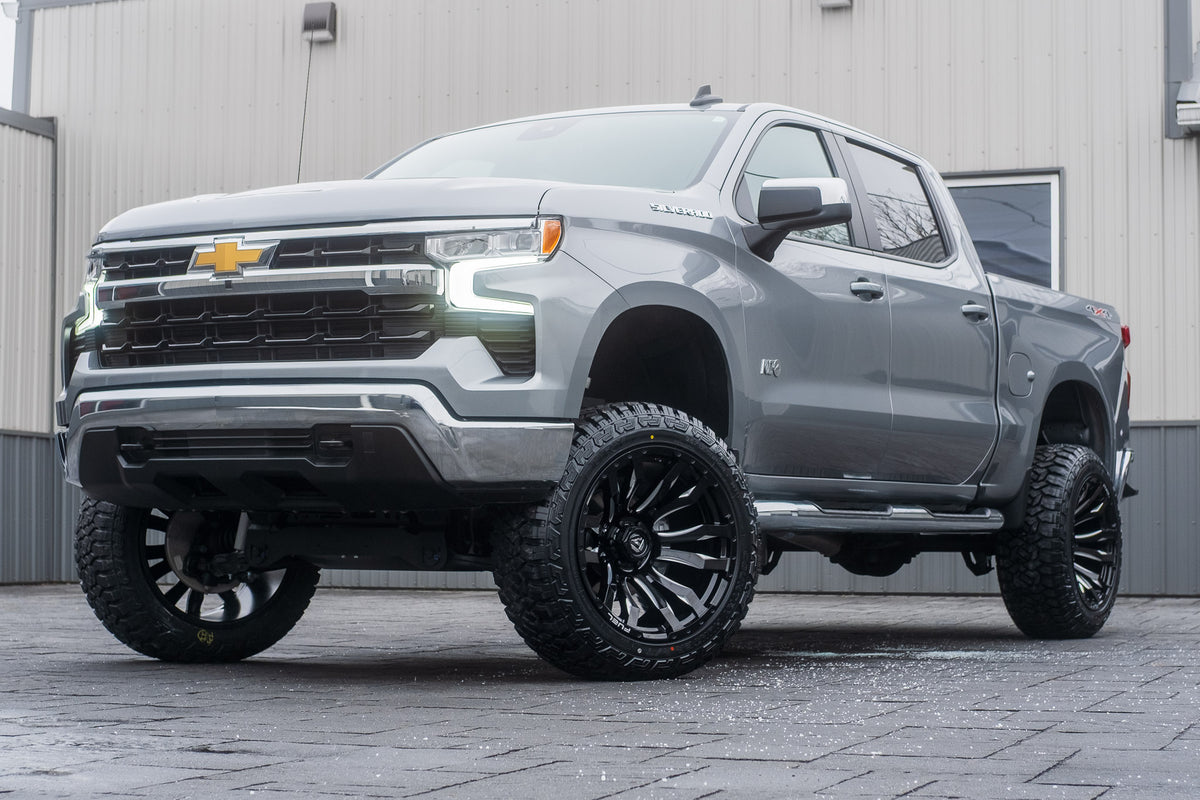 2023 Chevrolet Silverado 1500 LT with a 6" Rough Country lift kit, 22x12 Fuel Blitz wheels, and 35" Fury Country Hunter R/T tires.