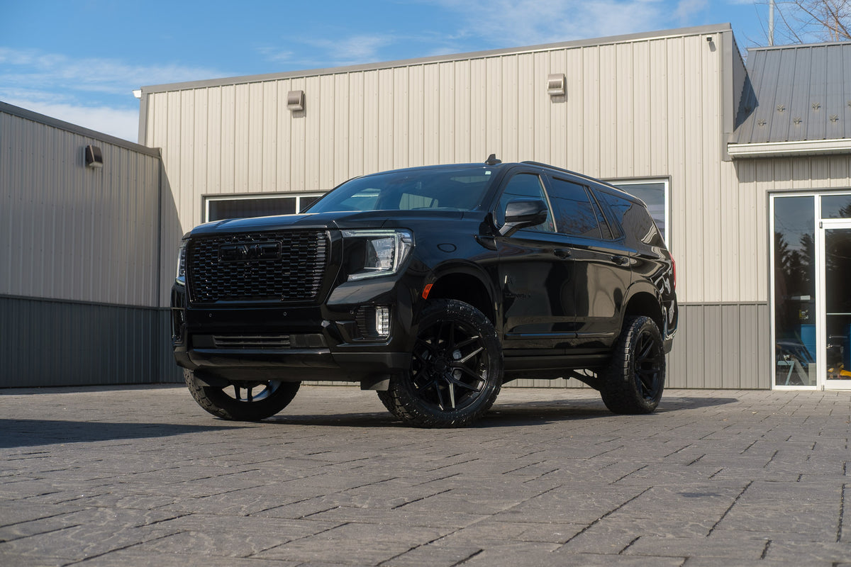 2023 GMC Yukon Denali with a 3" ReadyLift lift kit, 22x10 Fuel Flux wheels, and 295/50 Toyo Open Country A/T III tires.
