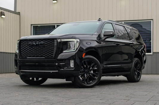 2023 GMC Yukon SLT with GMC Factory suspension, 22x9 GMC Stock wheels, and Bridgestone Alenza tires.