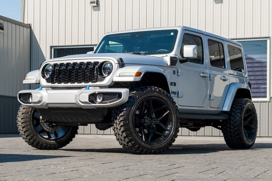 2024 Jeep Wrangler with a 2.5" Rough Country lift kit, 22x12 Fuel Flux wheels, and 35" TIS Offroad Hercules wheels.